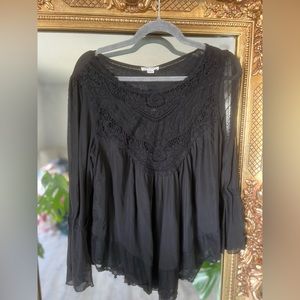 Black, flowy, lace blouse with sheer bell sleeves